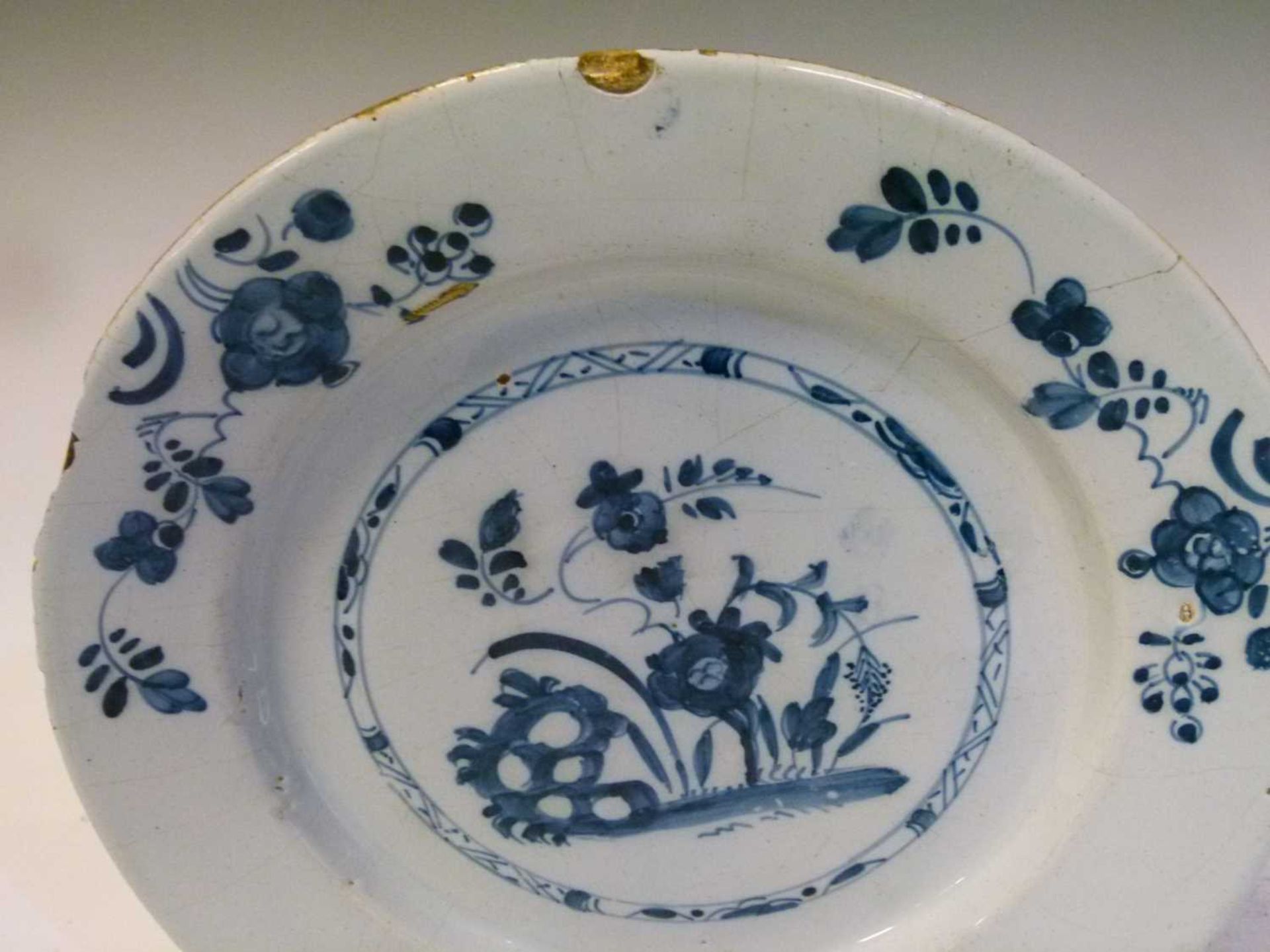 Four 18th Century English delft plates - Image 8 of 19