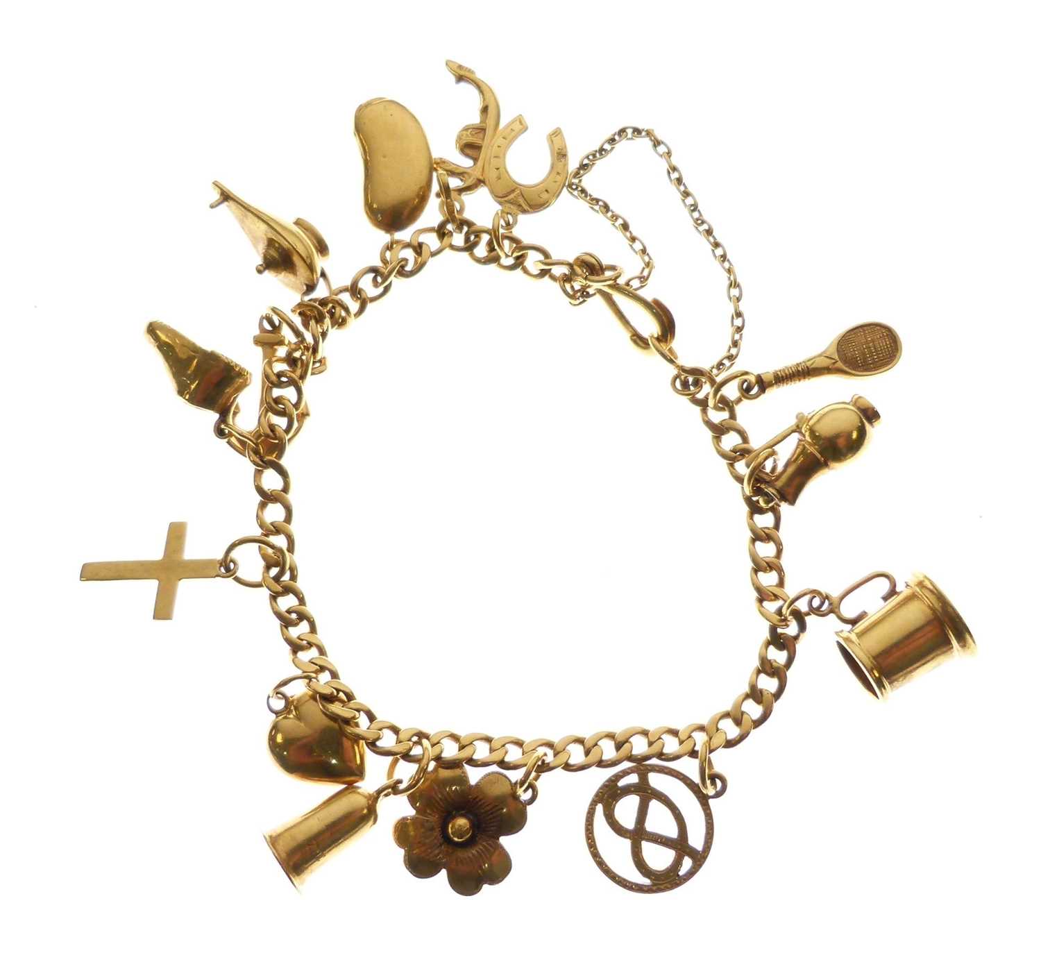 Yellow metal bracelet with various charms attached