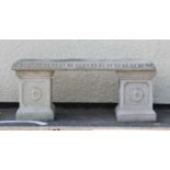 Composite stone garden seat having decorative supports