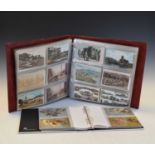 Four albums of early 20th Century postcards and suitcase