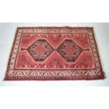 Small red ground Persian rug