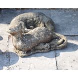 Composite stone garden figure of a reclining Spaniel and a figure of an Otter