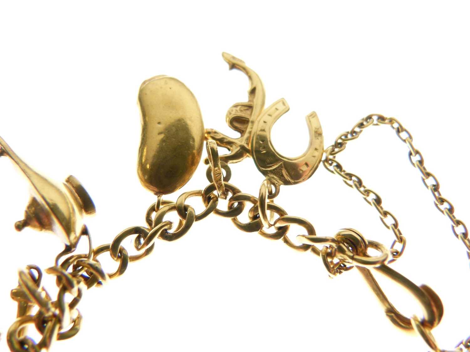 Yellow metal bracelet with various charms attached - Image 2 of 7