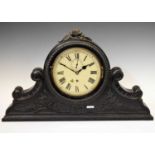Ebonised ships bulkhead clock in carved surround