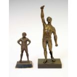 Cast figure of a Boy Scout and spelter figure of a wrestler