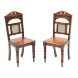 Pair of late Victorian tile-back hall chairs