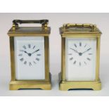 Two brass cased single barrel carriage time pieces