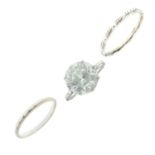 Single stone ring set large white faceted stone, the white metal shank stamped '18ct'