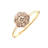 Diamond daisy cluster ring, stamped '18ct'