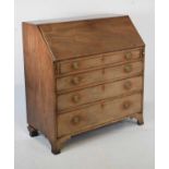 George III mahogany bureau comprising of four long drawers