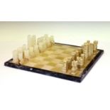 Onyx chessboard with Aztec-style chess pieces