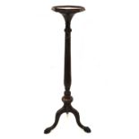 Mahogany torchiere or plant stand with carved decoration