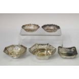 Four silver bonbon dishes together with a plated example