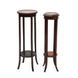 Two mahogany torchères or plant stands
