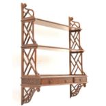 Set of mahogany fretwork hanging shelves