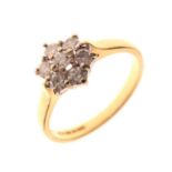 18ct gold, seven-stone diamond cluster ring