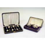 Cased set of six George VI silver coffee spoons and cased pair of napkin rings
