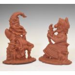 Pair of red painted cast metal Punch and Judy doorstops
