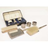 George V cased three-piece condiment set, three-piece silver backed dressing table set, etc
