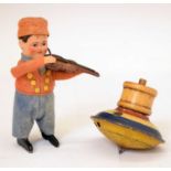 Schuco clockwork model of a violinist in felt costume and spinning top toy