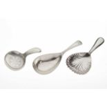 Two silver caddy spoons and a plated example