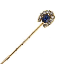 A sapphire and diamond horseshoe stick pin