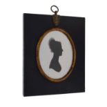 Oval silhouette on plaster of a lady