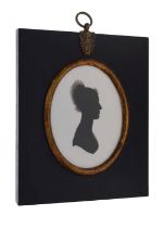 Oval silhouette on plaster of a lady