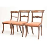 Pair of George IV sabre leg dining chairs, together with one other