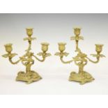 Pair of gilt metal rococo style three-branch candelabra