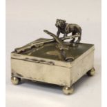 Early 20th century silver plated box with hinged lid decorated with rifles and bulldog