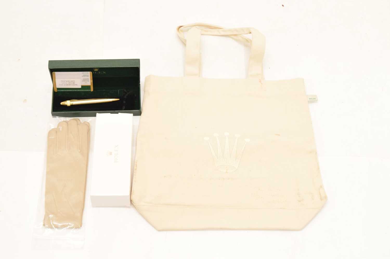 Rolex - Gilt metal retractable ballpoint pen, pair of dealers gloved and tote bag - Image 2 of 10