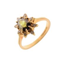 18ct gold dress ring set a faceted green stone