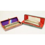 Two cased Hohner 'The Super Chromonica' harmonicas