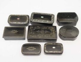 Group of eight ebonised snuff boxes