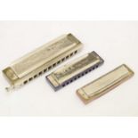 Group of three harmonicas