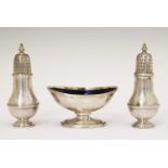 George III silver boat-shaped salt and a pair of George V silver baluster form casters