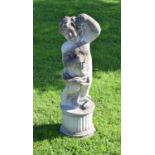 Composite stone garden statue of a cherub holding grapes