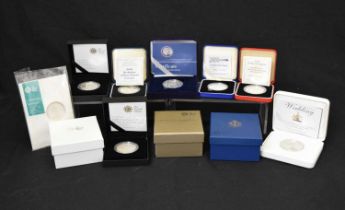 Twelve Royal Mint Brilliant silver proof Crown and Commemorative £5 coins