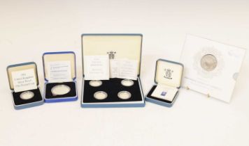 Five Elizabeth II silver-proof presentation packs