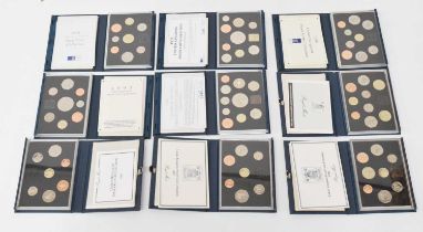 Seventeen Royal Mint UK Proof Coin Sets, in presentation cases