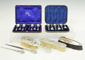 Two cased sets of silver teaspoons, and a quantity silver backed dressing table items
