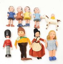 Three Norah Wellings dolls and a group of painted wooden dolls
