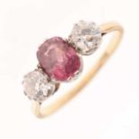 Pink stone and diamond three-stone ring