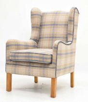 Modern wingback armchair upholstered in tartan wool fabric