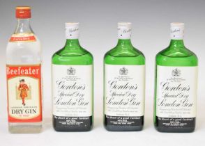 Three bottles of Gordon's gin, and a bottle of Beefeater gin (4)