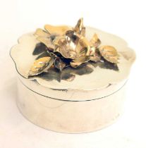 Elizabeth II circular silver box the lid decorated with gilt flowers