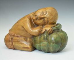 Carved wooden figure of a sleeping child/monk