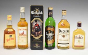 Glenfiddich, Teachers Perfection, Famous Grouse, White Horse and a half bottle of Bells whisky
