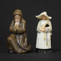 Worcester porcelain candle snuffer 'kneeling monk' and 'nun' (2)